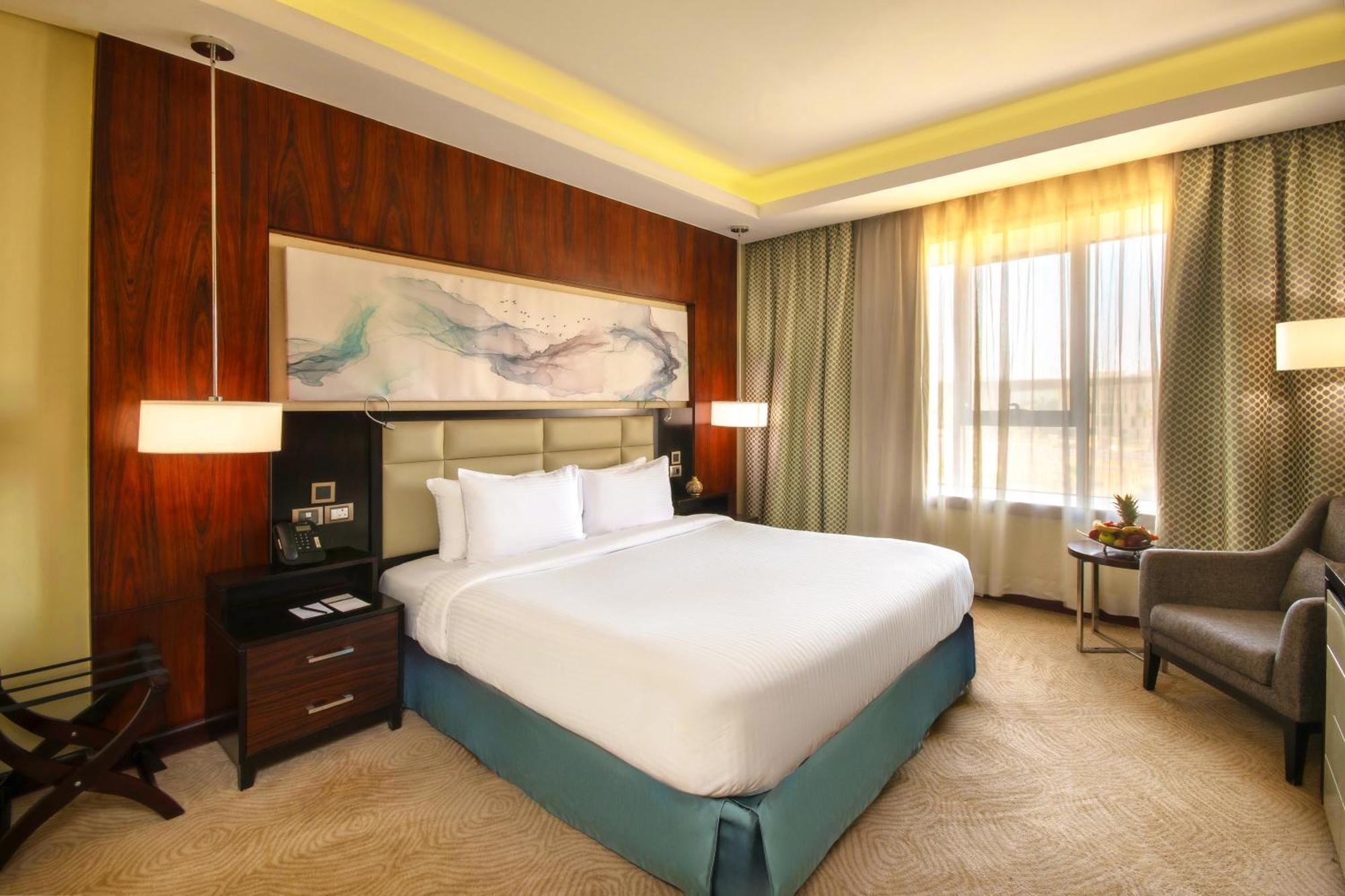 Triumph Luxury Hotel Kahire Oda fotoğraf A bedroom at the hotel